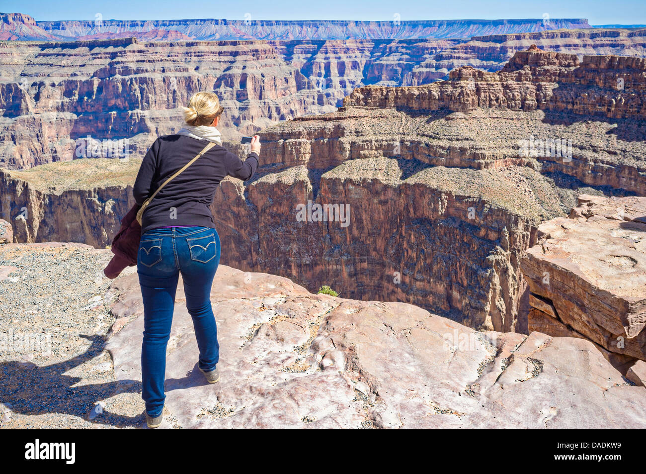 USA, Arizona, Young woman taking picture of Grand Canyon Stock Photo ...
