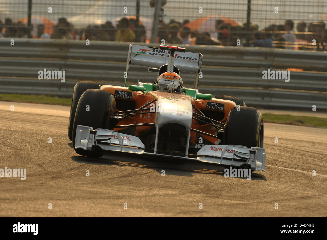 German Formula One driver Adrian Sutil of Force India steers his car during the race at the Buddh International Circuit, Greater Noida, India, 30 October 2011. Photo: David Ebener dpa Stock Photo