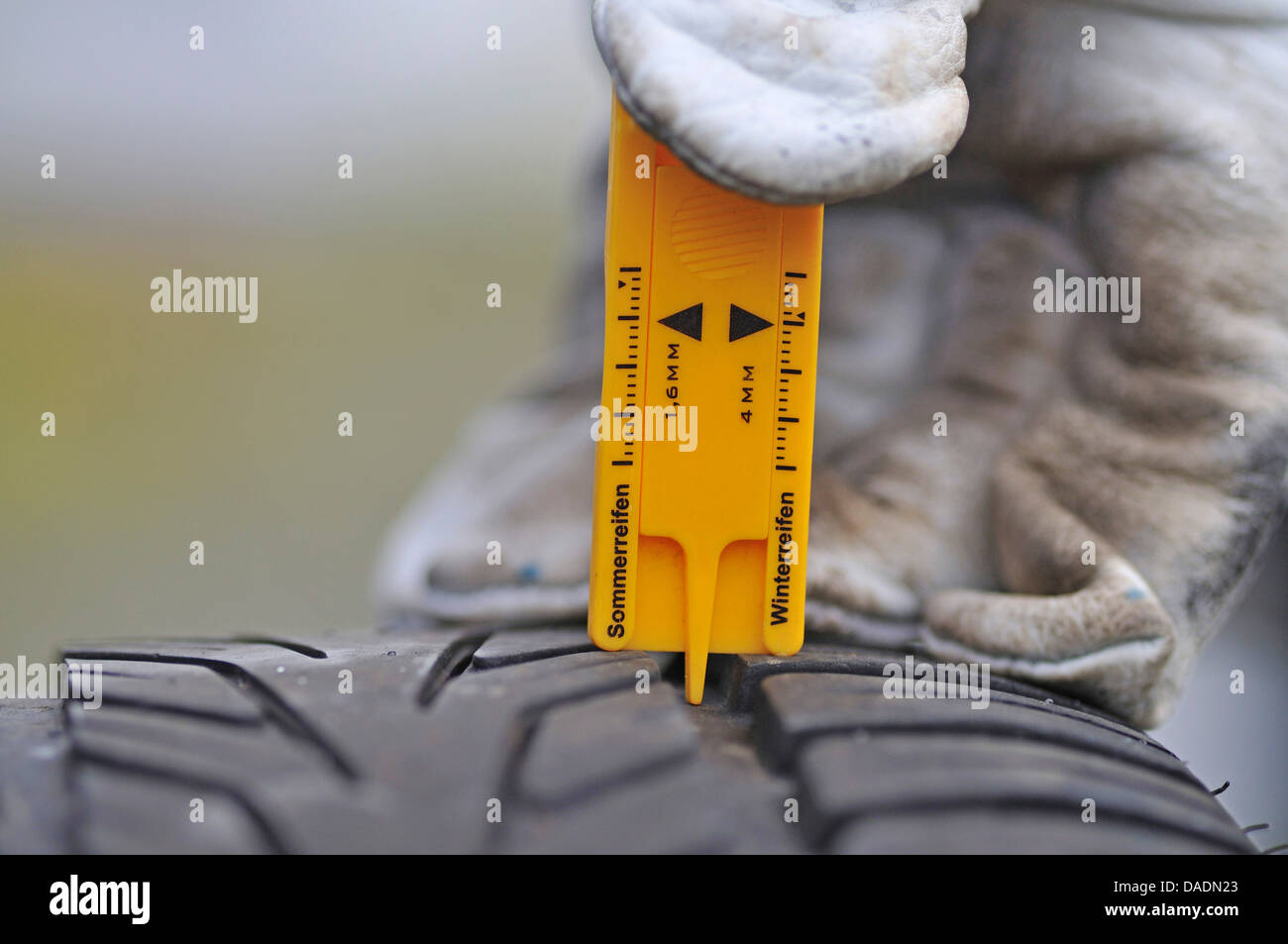 measuring the tread depth of a tire Stock Photo Alamy