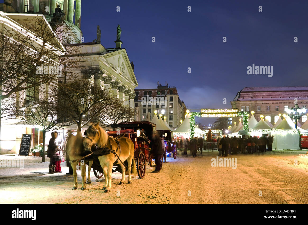 Germany, Berlin, Horse drawn carriage in christmas market at