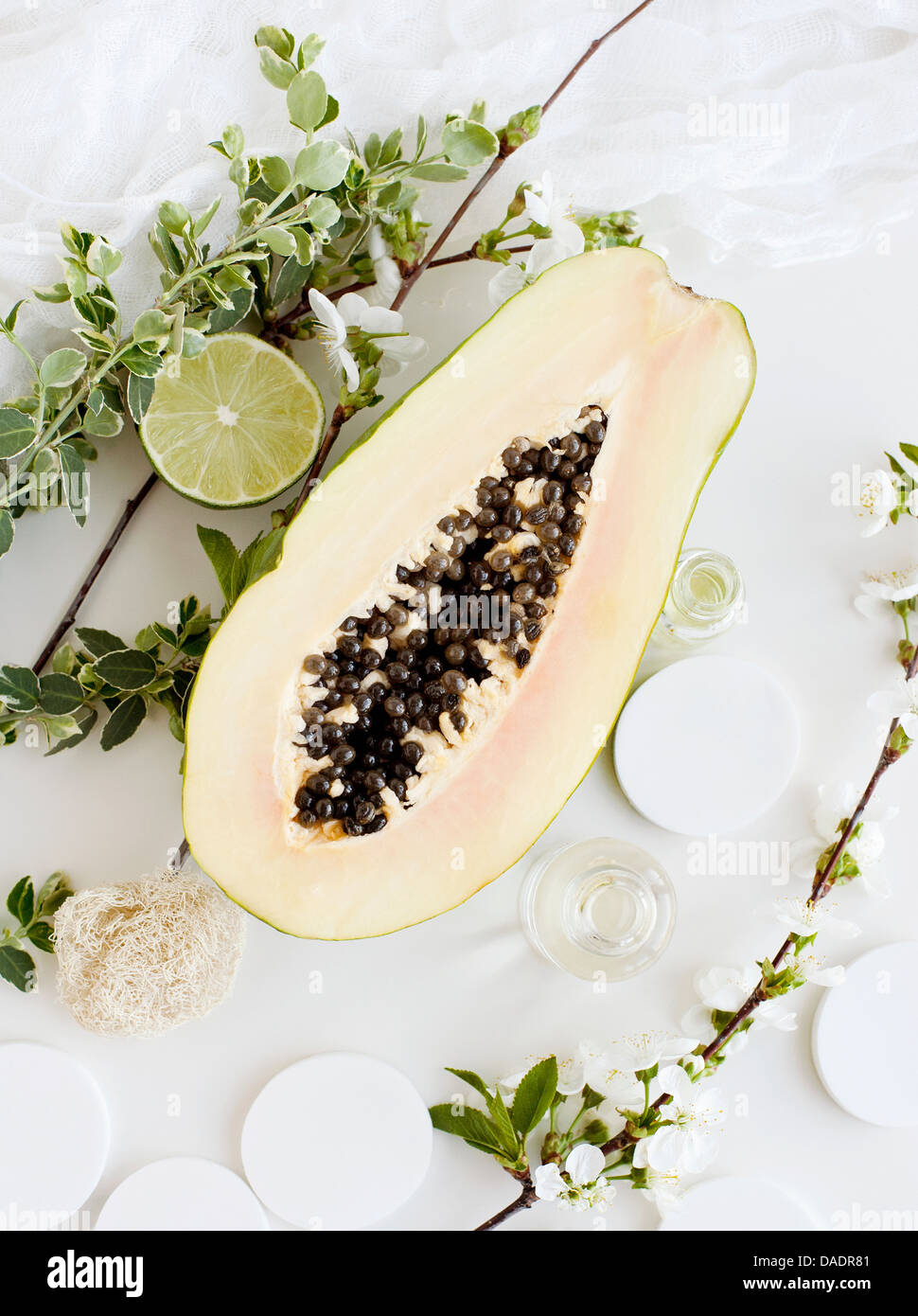 Aromatic still life with papaya, blossom and lime Stock Photo Alamy