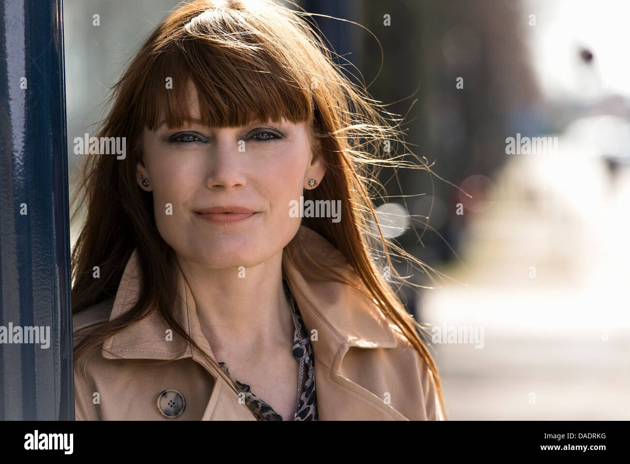 Close up portrait of woman in street Stock Photo