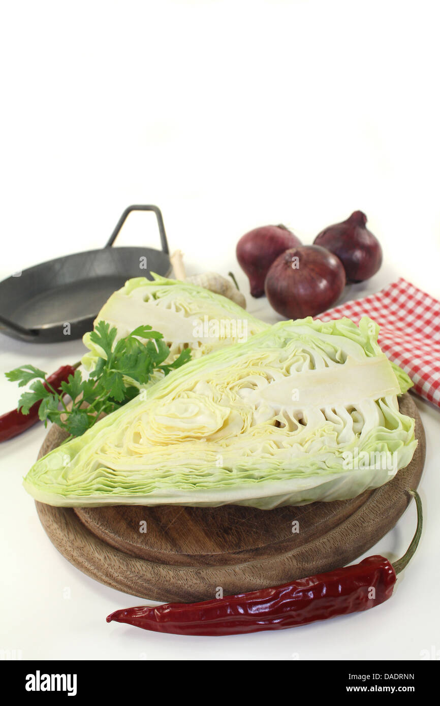 a sliced sweetheart cabbage on a wooden board Stock Photo
