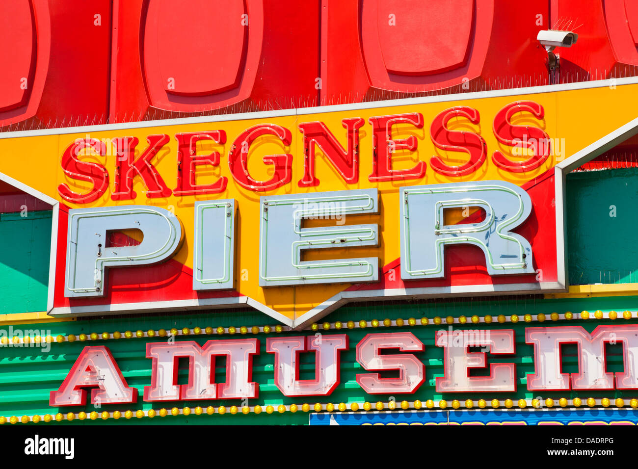 neon signs for an amusements and the Pier at Skegness Lincolnshire England UK GB EU Europe Stock Photo