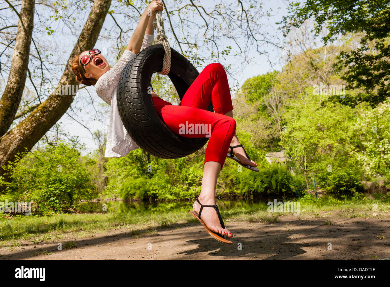 Woman having fun on swing hi-res stock photography and images - Alamy