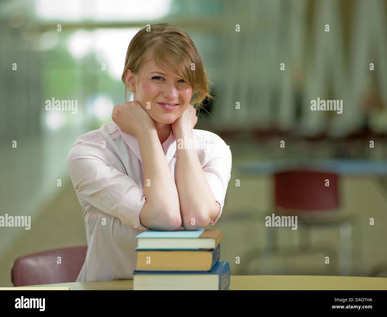 Young student leaning on school books, portrait Stock Photo