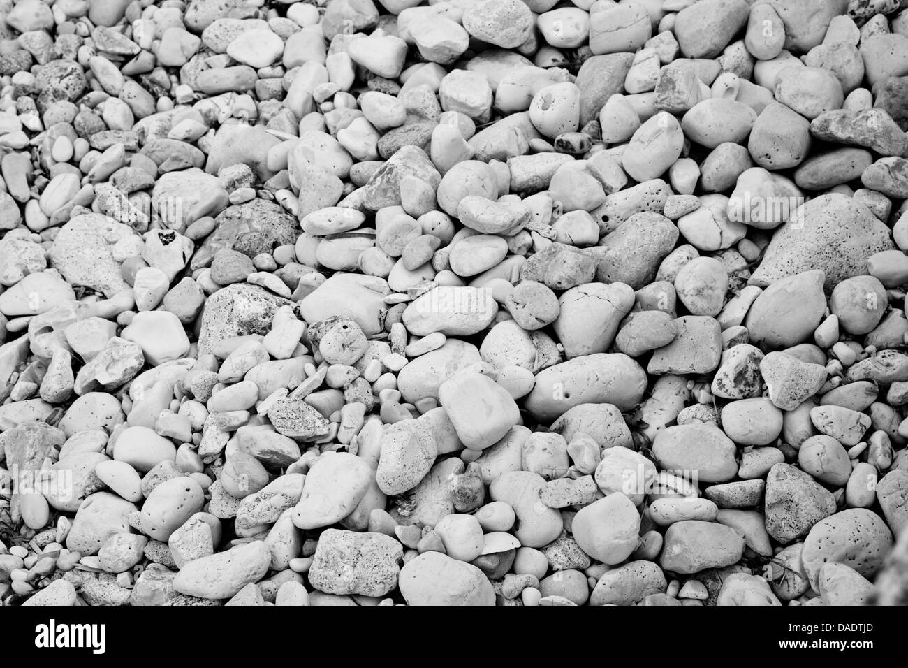 Black and white pebbles on a beach Stock Photo