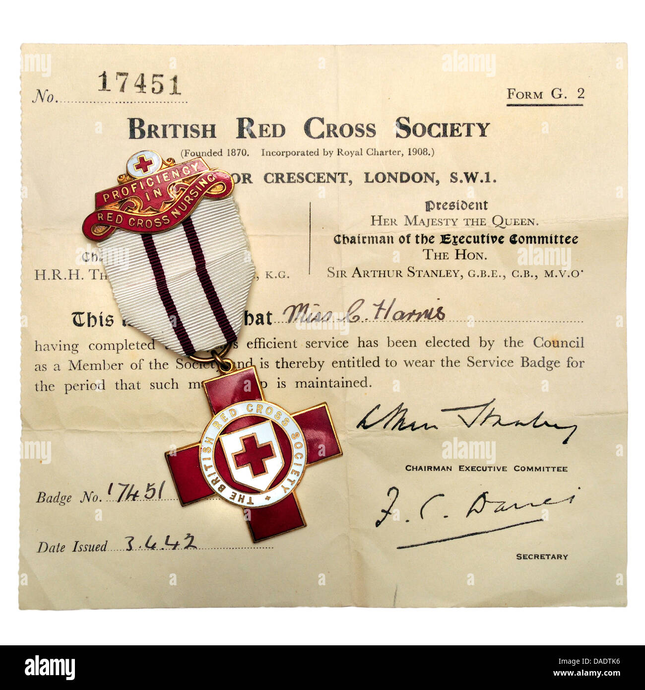 British Red Cross Society Service Badge, for three years efficient service and election to the Society. With original document Stock Photo