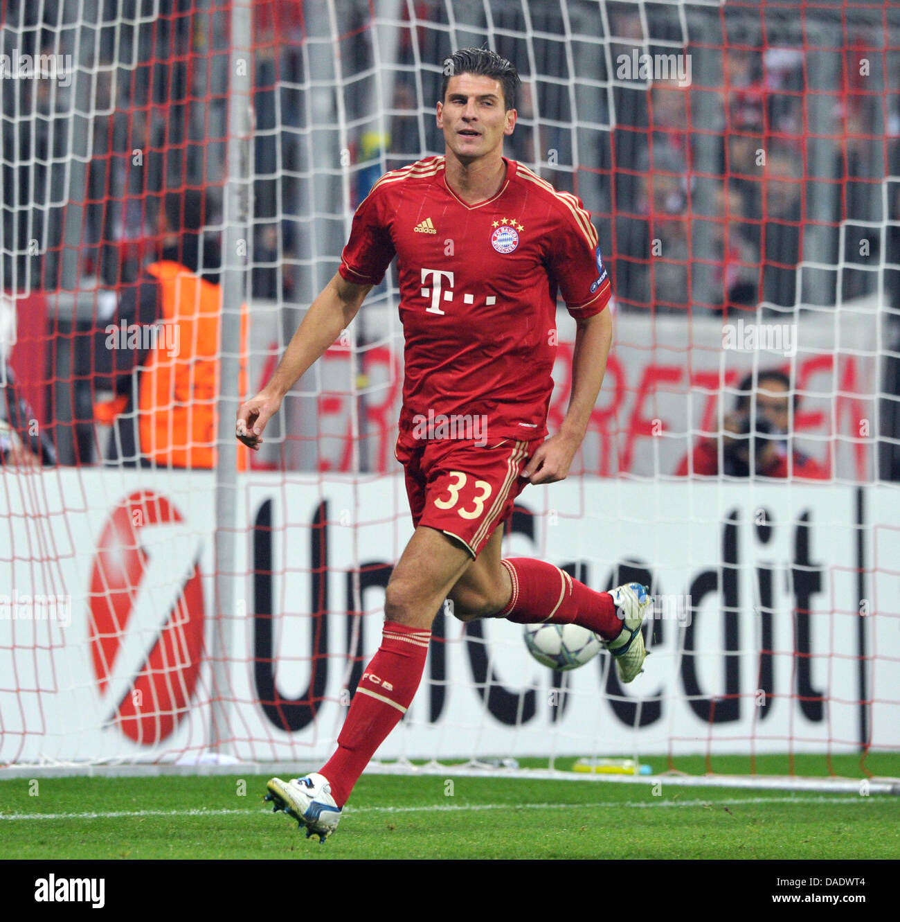 Bayern Munich's Mario Gomez cheers after scoring the 2-0 goal during the  first half of the Champions League group A match between FC Bayern Munich  and SSC Neapel at the Allianzarena stadium
