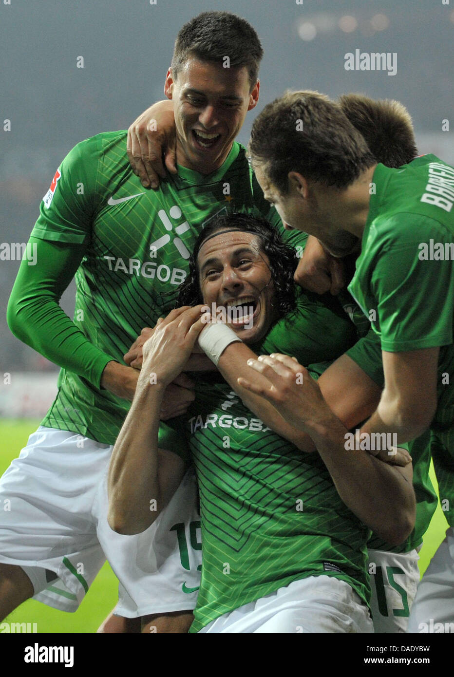 Bremen's Claudio Pizarro (C) celebrates his thrid goal for the 3-2 with teammates Sandro Wagner (L) and Philipp Bargfrede (R) during the Bundesliga soccer match between Werder Bremen against FC Cologne at the Weser Stadium in Bremen, Germany, 05 November 2011. Photo: CARMEN JASPERSEN  (ATTENTION: EMBARGO CONDITIONS! The DFL permits the further  utilisation of the pictures in IPTV,  Stock Photo