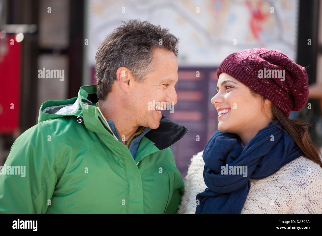 Couple in warm clothing smiling Stock Photo - Alamy