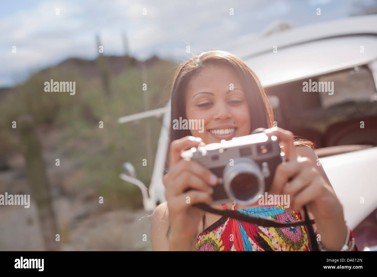 Woman looking down a long road hi-res stock photography and images - Alamy