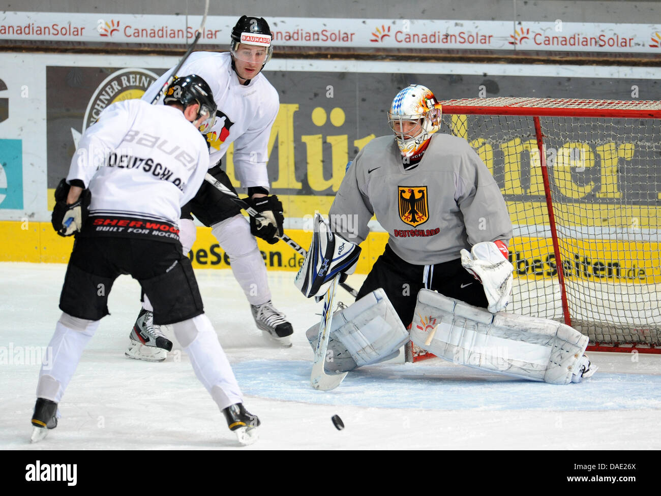 German national ice hockey team player Jochen Reimer (R) defends his