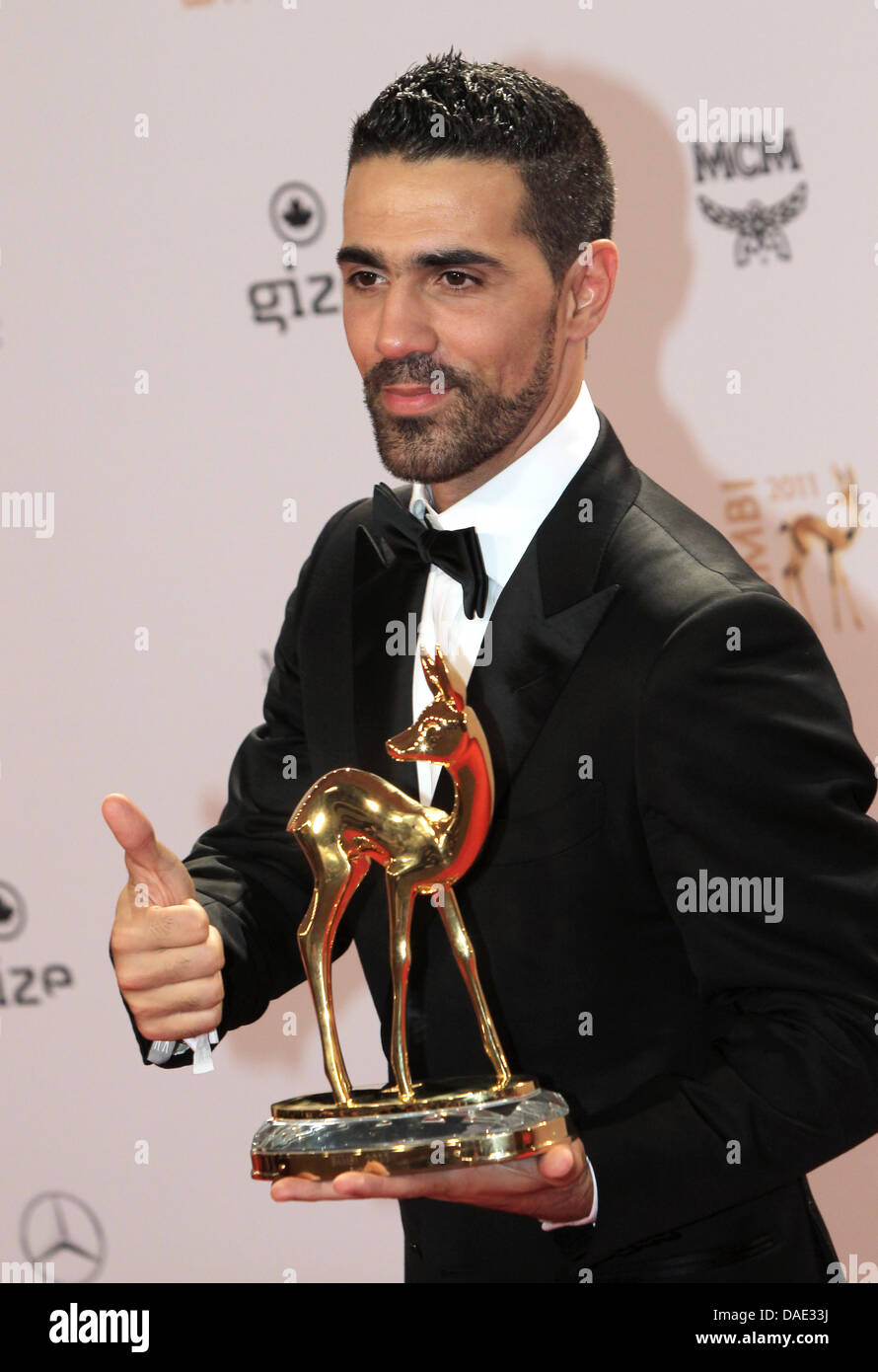 German singer Bushido poses with the Bambi trophy in the press room after the award ceremony in Wiesbaden, Germany, 10 November 2011. The Bambis are the main German media awards and are  presented for the 63rd  time. Photo: Frank Rumpenhorst dpa/lhe Stock Photo
