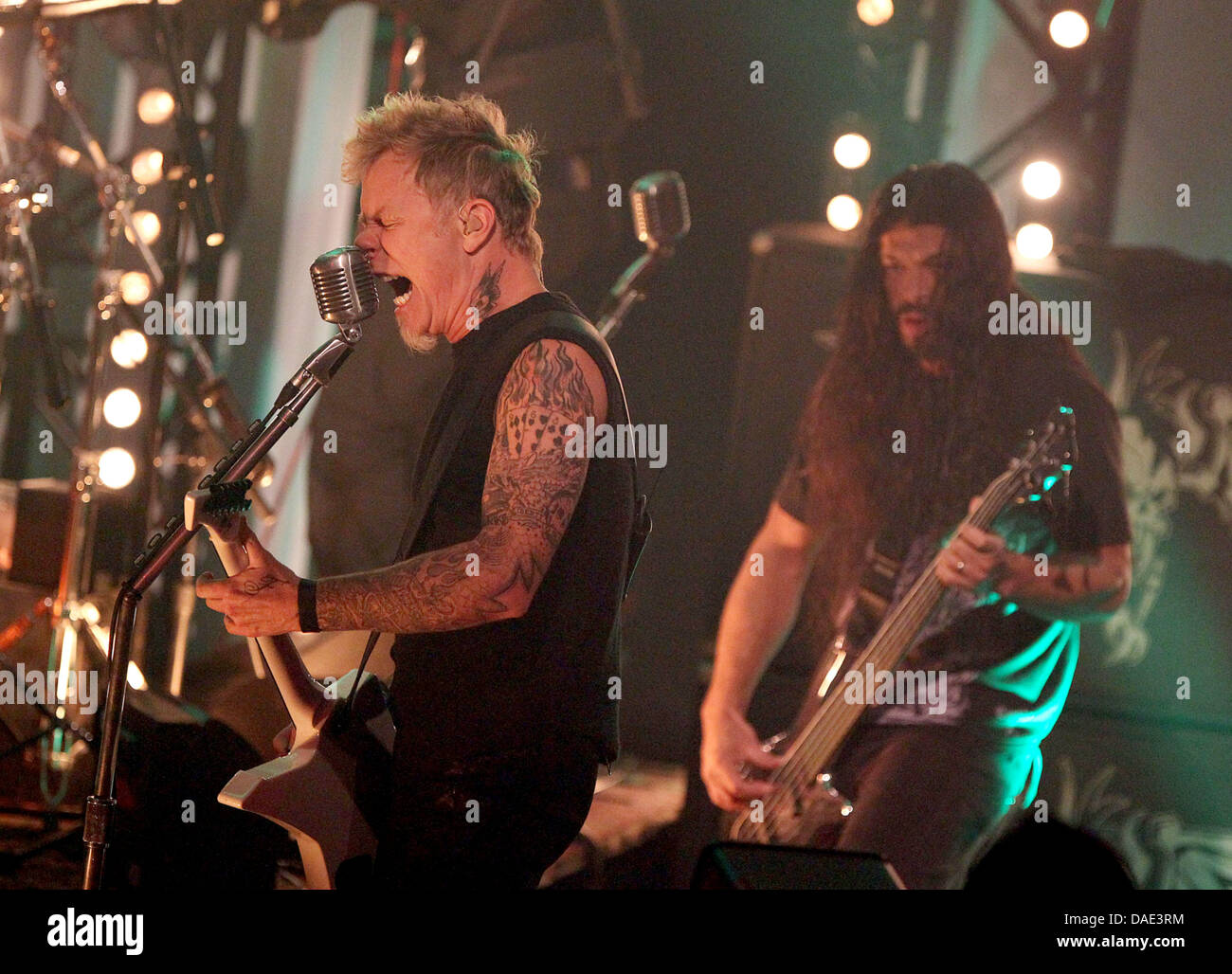 Singer and guitarist of the band Metallica James Hetfield (L) and bass