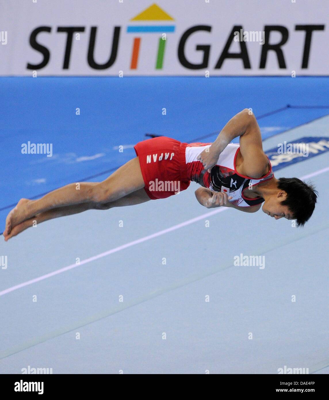 Japanese athelete Shogo Nonomura performs on floor during the Gymnastics World Cup at the Porsche Arena in Stuttgart, Germany, 13 November 2011. Shogo Nonomura won the combined event. Photo: MARIJAN MURAT Stock Photo