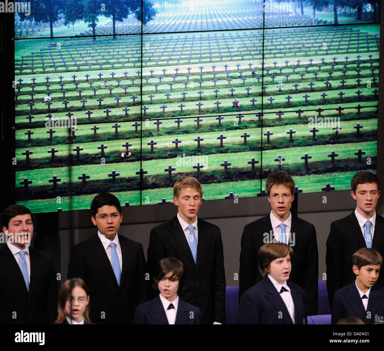 The Regensburg cathedral choir performs in front of a video wall showing a soldier's cemetry at the Reichstag in Berlin, Germany, 13 November 2011. The event took place on the occassion of the Remembrance Day, a memorial day observed since the end of World War I to remember the members of armed forces who have died in the line of duty. It is observed on 11 November to recall the of Stock Photo