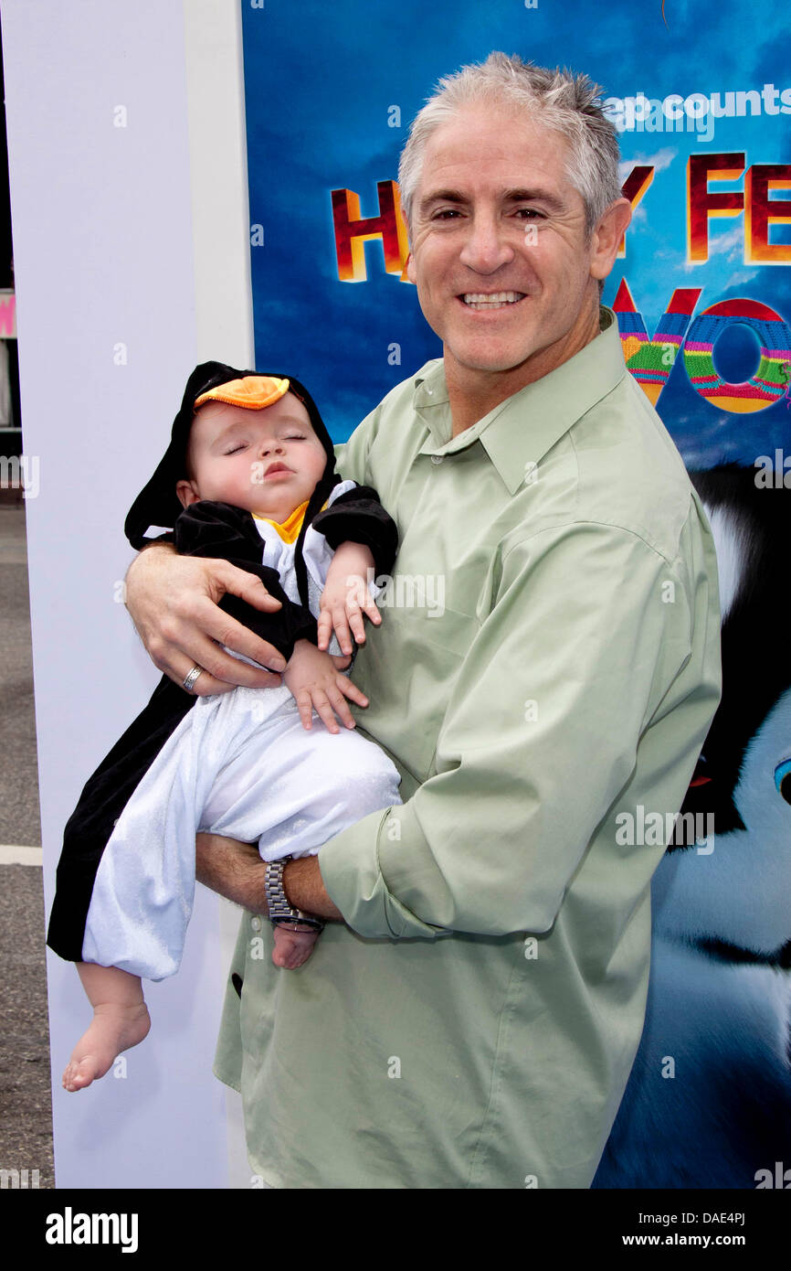 US actor Carlos Alazraqui and daughter arrive for the World Premiere of the movie 'Happy Feet Two' at Grauman's Chinese Theatre in Los Angeles, USA, on 13 November 2011. Photo: Hubert Boesl Stock Photo