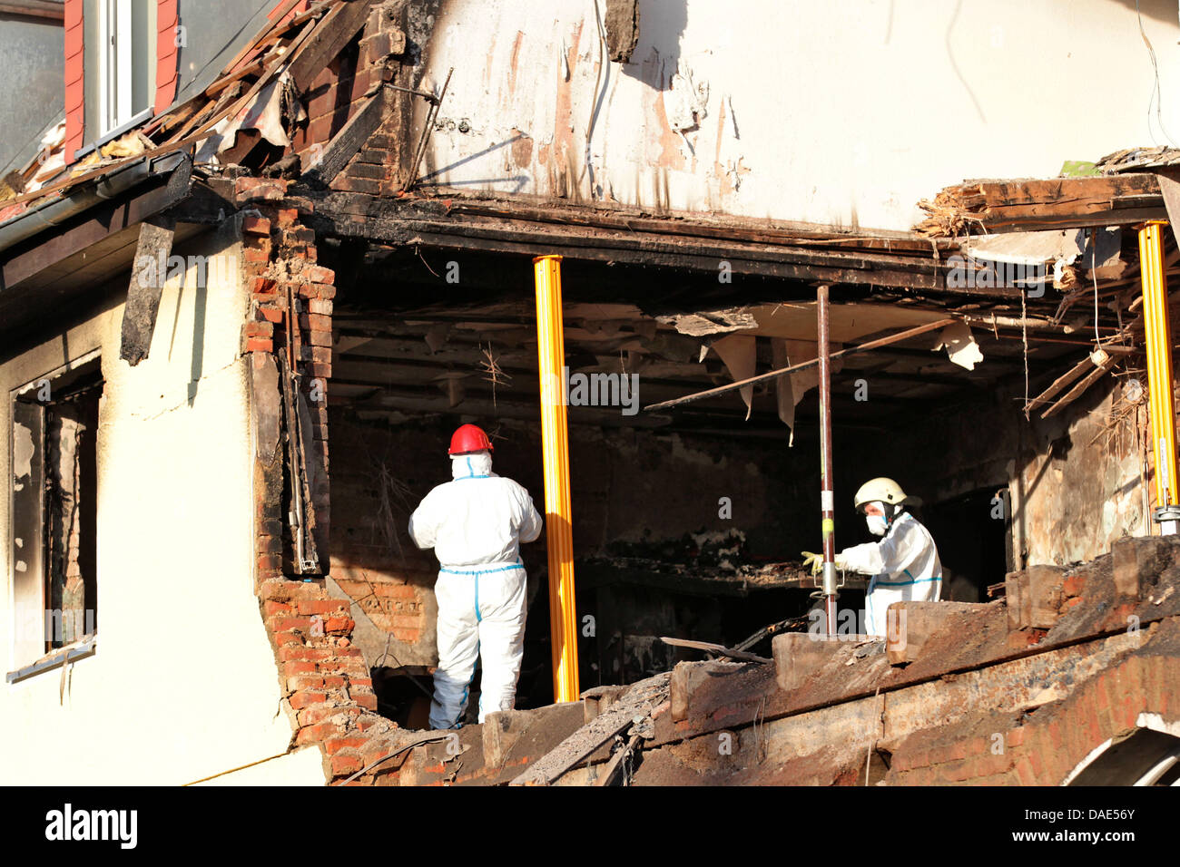 Forensics officers work inside an exploded house in Zwickau, Germany ...
