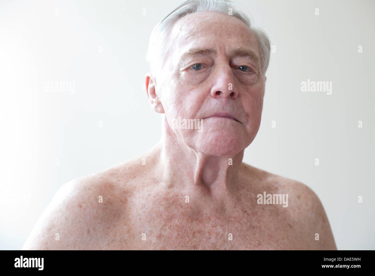 Portrait of topless senior man Stock Photo
