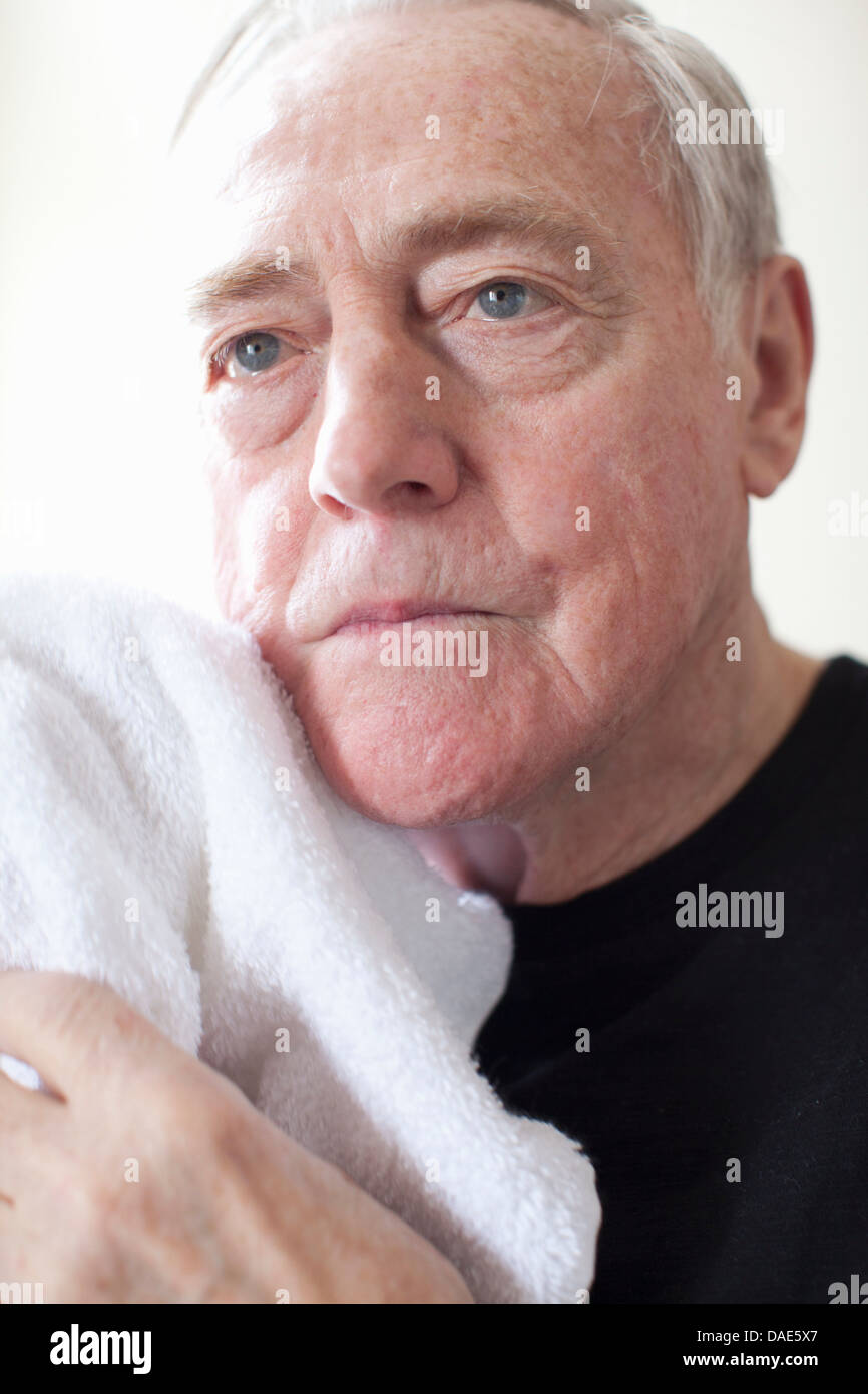 Senior man with white towel Stock Photo