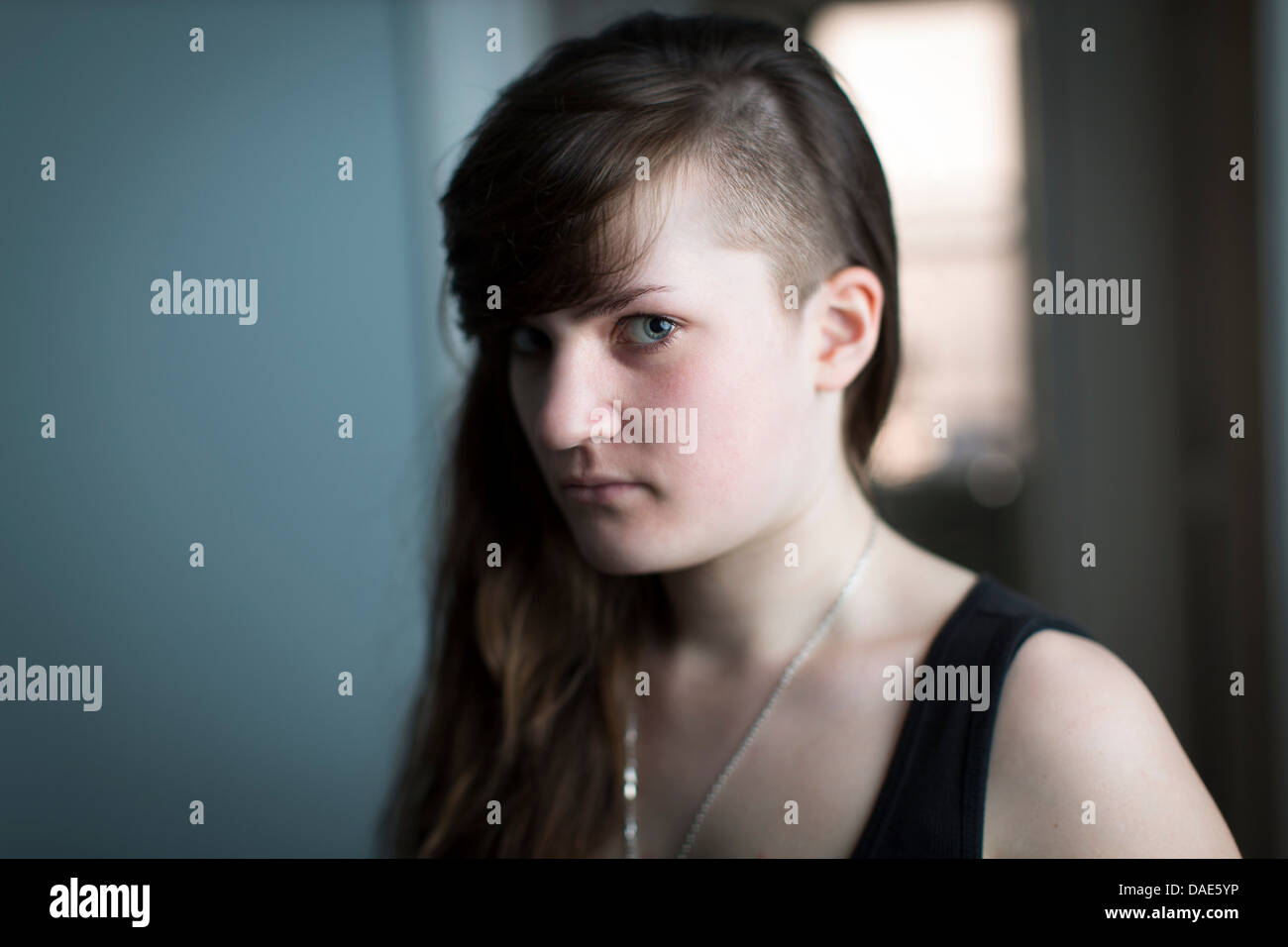 Portrait of young woman looking at camera Stock Photo