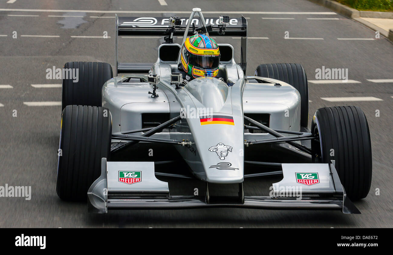 Brazilian racecar driver Lucas di Grassi drives a Formula E racecar