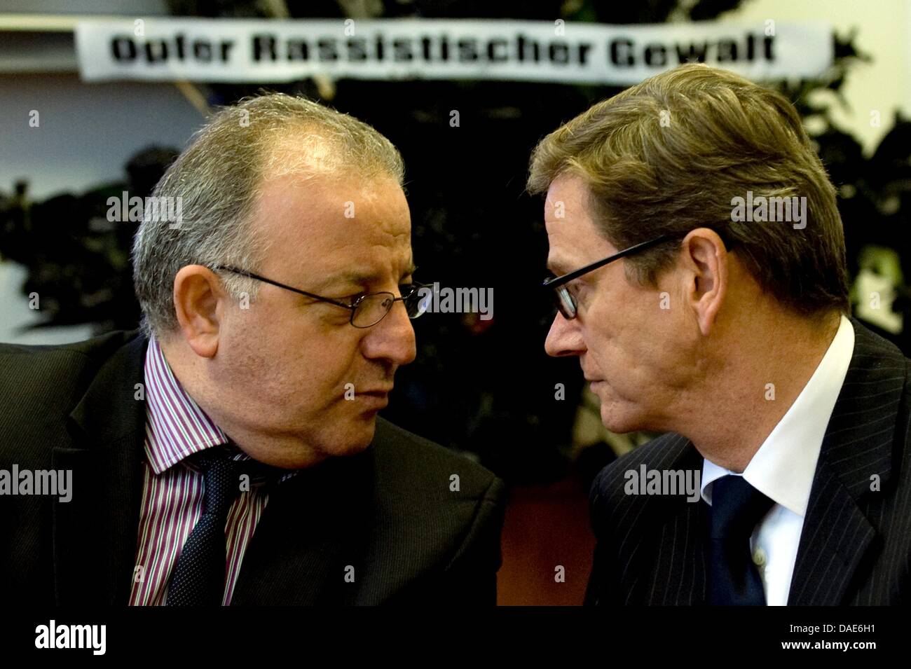 German Foreign Minister Guido Westerwelle and Kenan Kolat (L), Chairman of the Turkish Community in Germany, speak in the headquarters of the Turkish Community in Germany in Berlin, Germany, 15 November 2011. The reason for the visit is the newest information about the right-wing motivated murders of foreign fellow citizens. Photo: SEBASTIAN KAHNERT Stock Photo