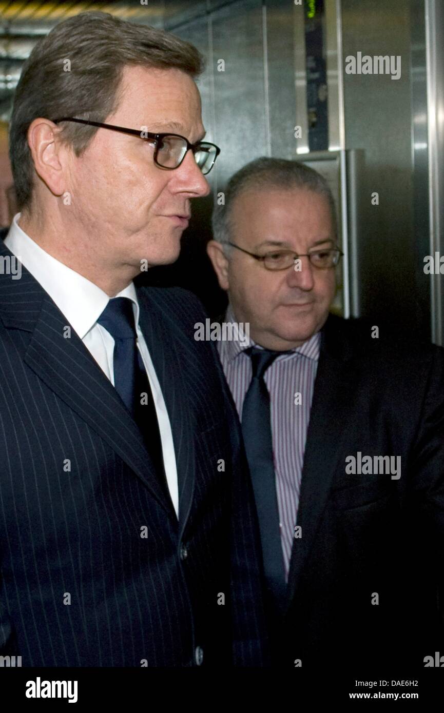 German Foreign Minister Guido Westerwelle and Kenan Kolat (L), Chairman of the Turkish Community in Germany, leave the elevator in the headquarters of the Turkish Community in Germany in Berlin, Germany, 15 November 2011. The reason for the visit is the newest information about the right-wing motivated murders of foreign fellow citizens. Photo: SEBASTIAN KAHNERT Stock Photo