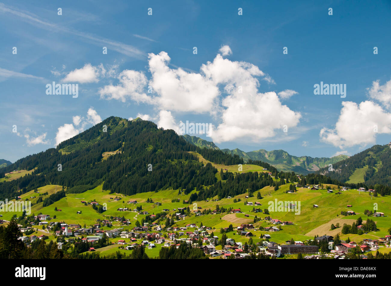 panoramic view over the mountain village in the Kleinwalsertal with the Heuberg (1795 m) in the background, Austria, Vorarlberg, Allgaeu, Hirschegg Stock Photo