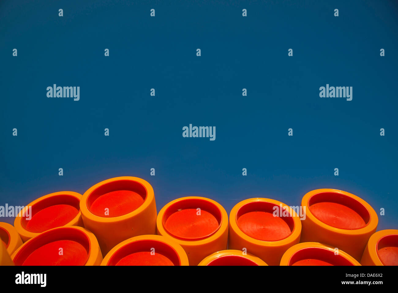 stack of plastic tubes with sealing plugs at a construction site, Germany Stock Photo