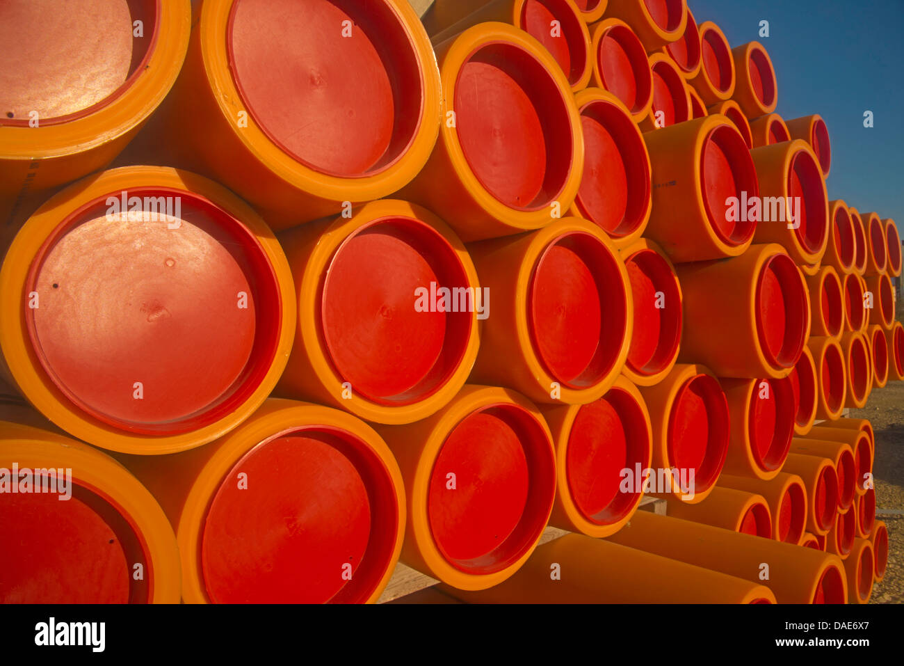 stack of plastic tubes with sealing plugs at a construction site, Germany Stock Photo