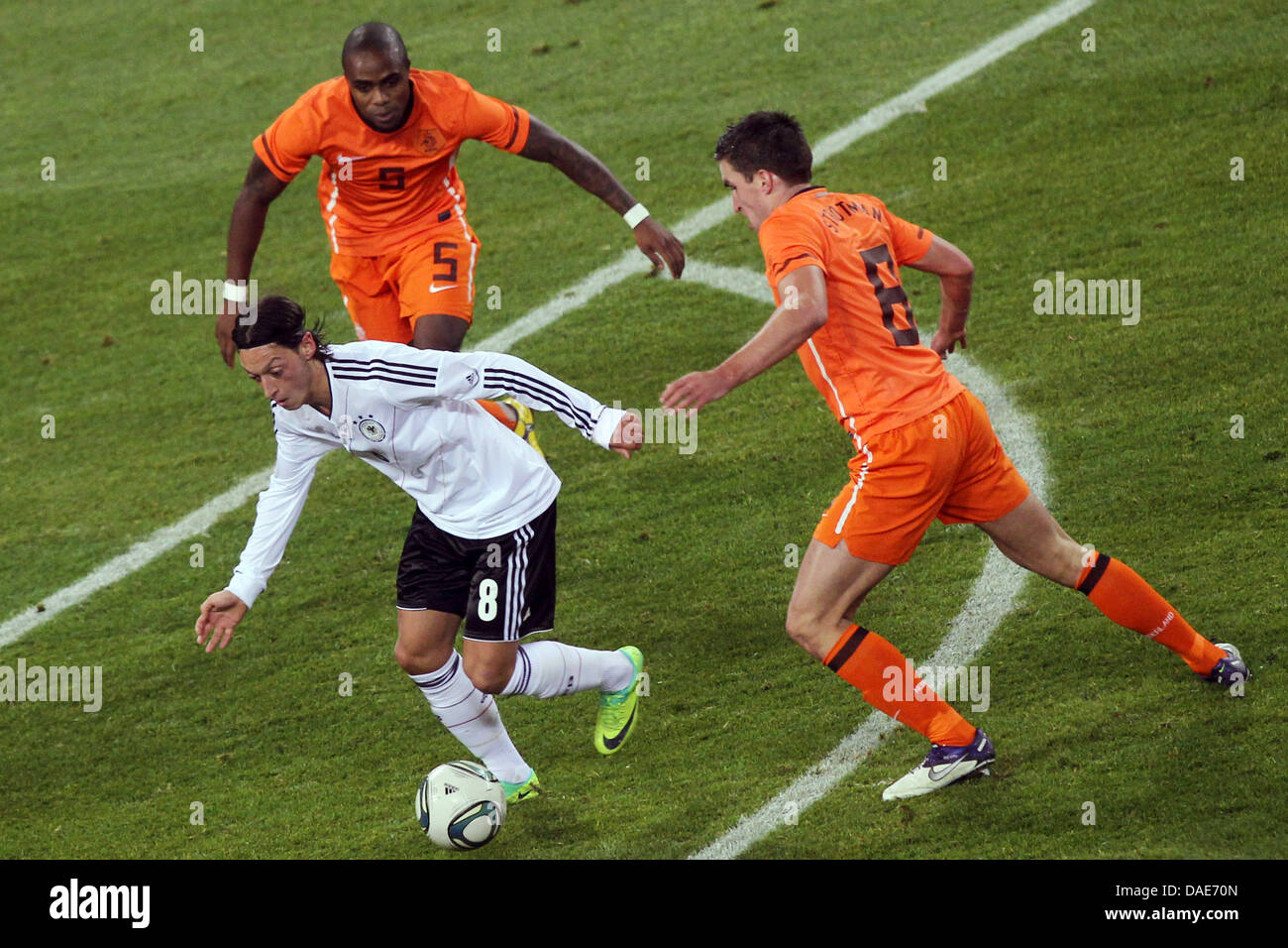 germany-s-mesut-zil-l-and-dutch-edson-braafheid-c-and-kevin
