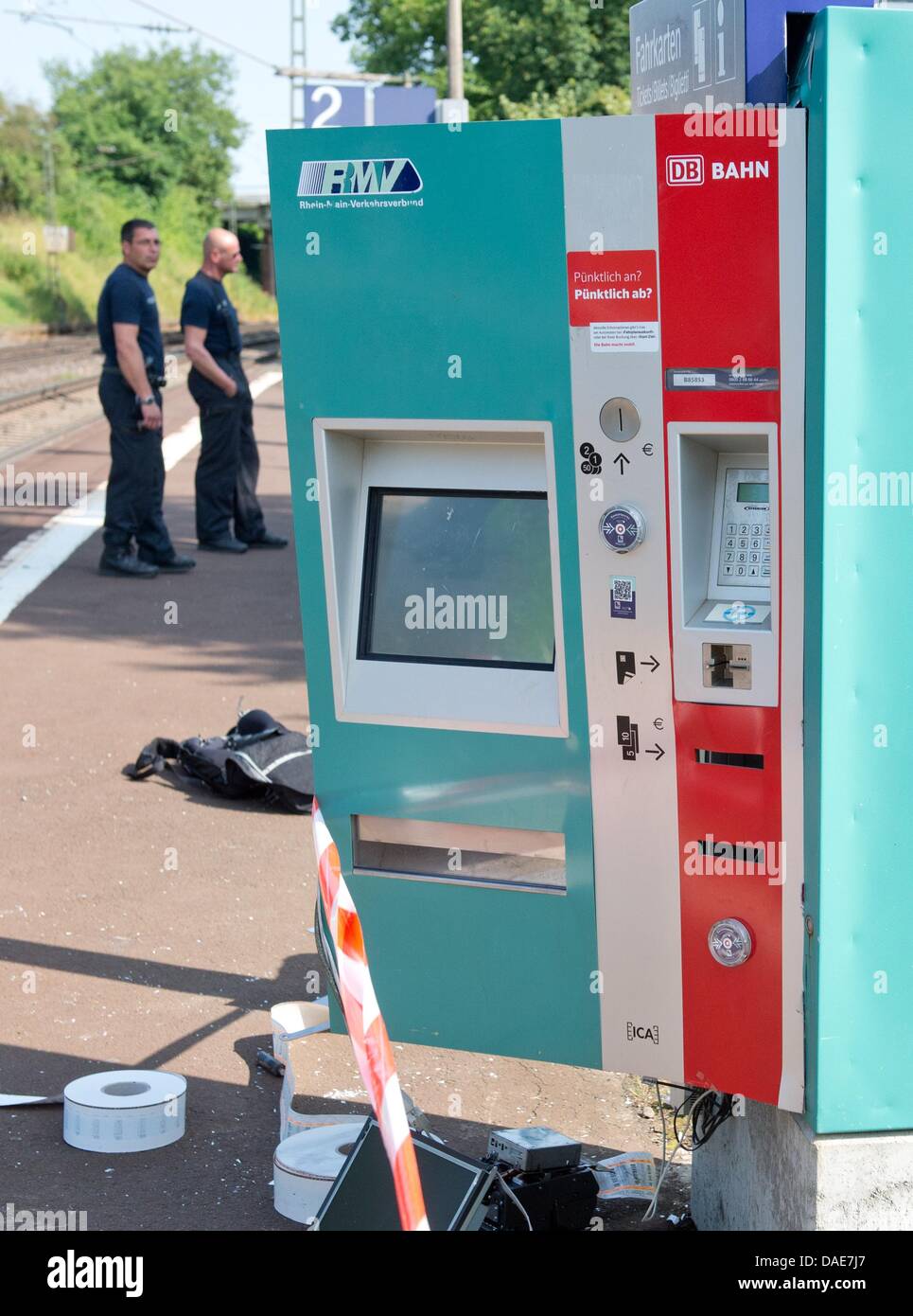 A fully destroyed ticket vending machine is pictured on a platform in the railway station in Kirch Goens near Giessen, Germany, 10 July 2013. A perpetrator used gas to blow-up a railway ticket vending machine to steal an unknown amount of money in the early morning hours. The machines have been targeted in the past months. Photo: BORIS ROESSLER Stock Photo