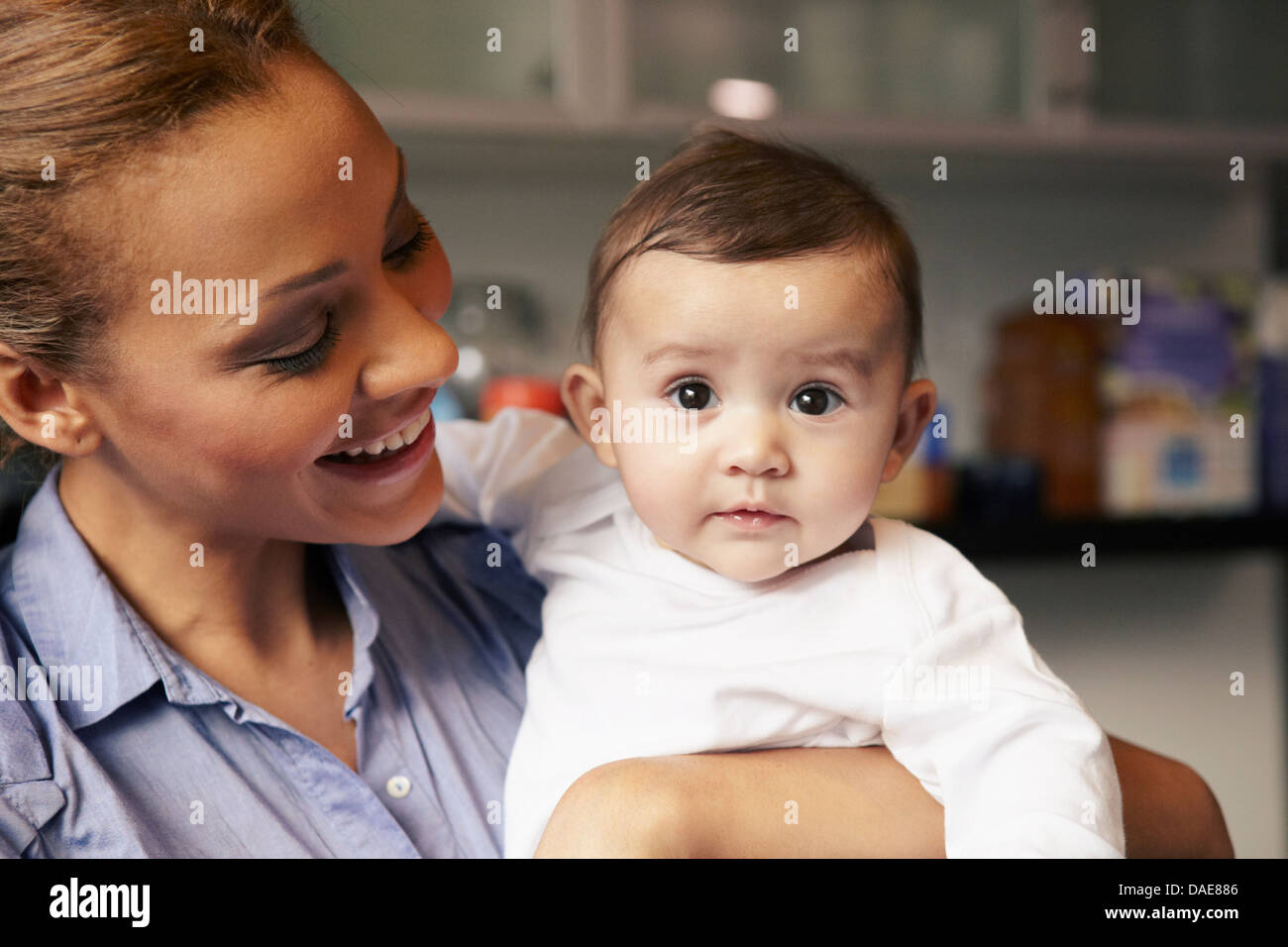 Mother holding baby girl Stock Photo - Alamy