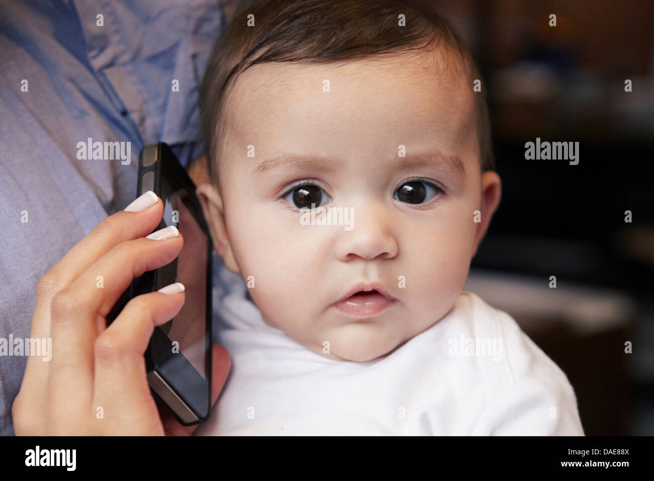 Baby girl listening to cell phone Stock Photo Alamy