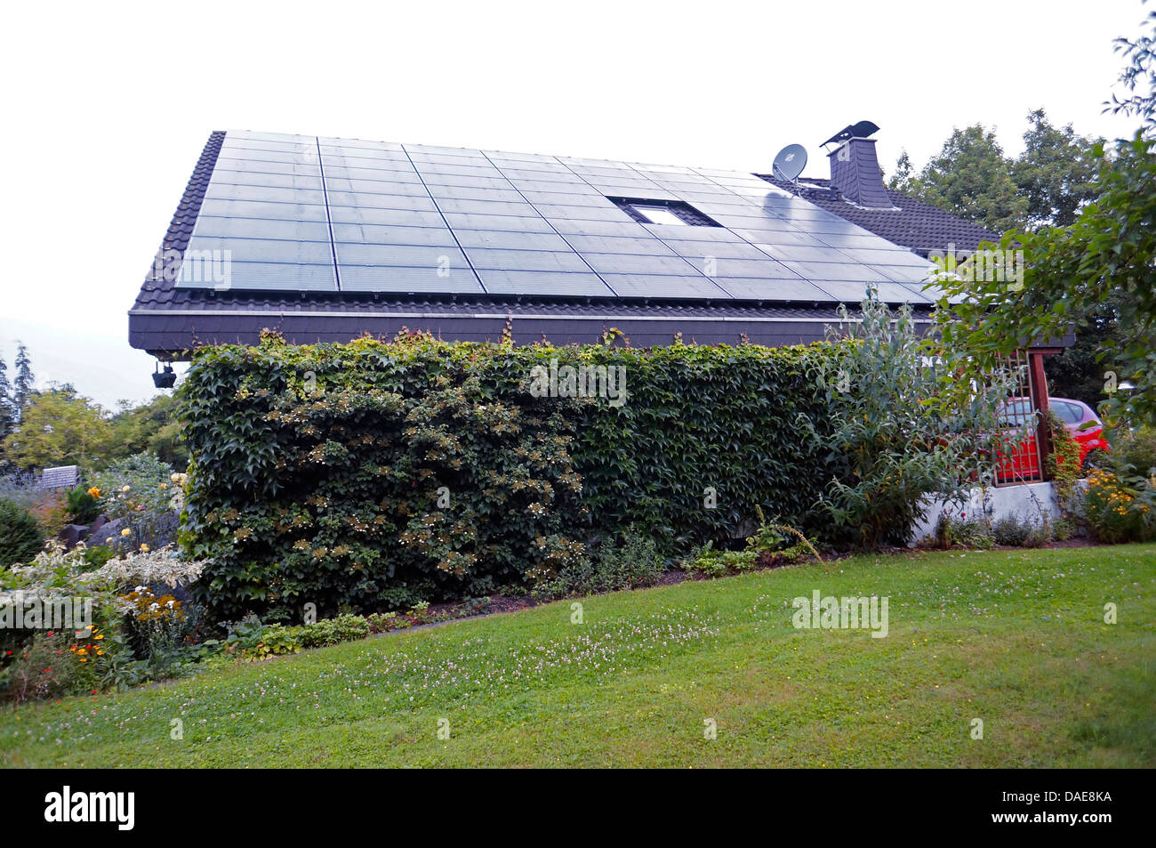 Solar cells on a house roof hi-res stock photography and images - Alamy