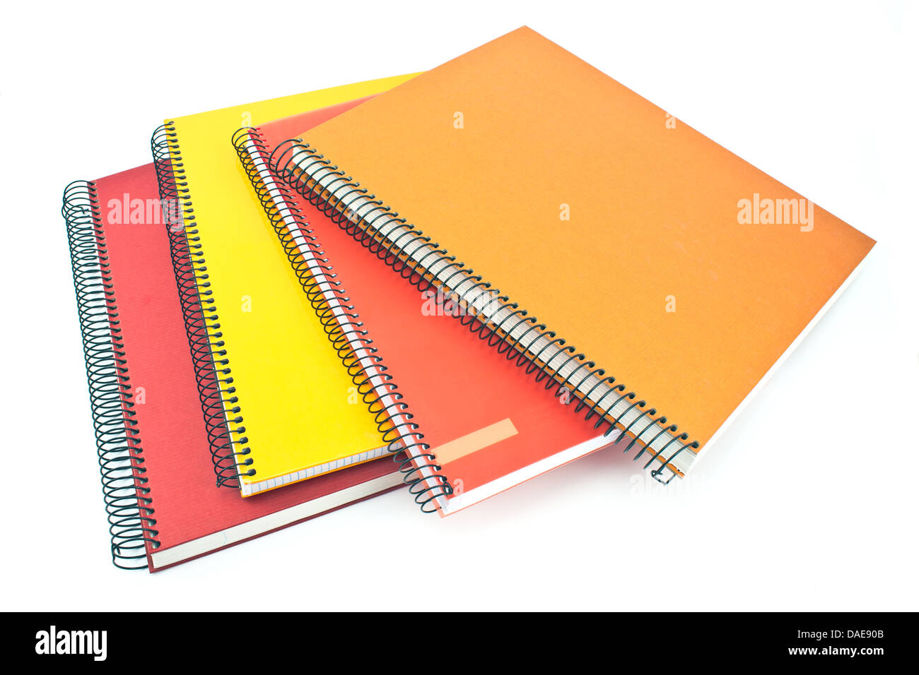 Stack of colorful spiral notebooks isolated on white Stock Photo