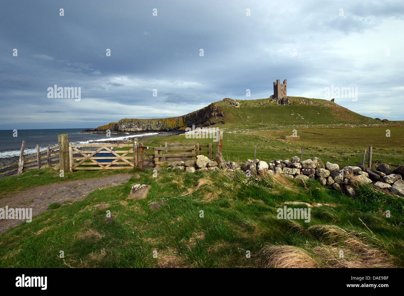 Dunstanburgh Castle on St Oswalds Way Long Distance Footpath Northumberland Coast Stock Photo