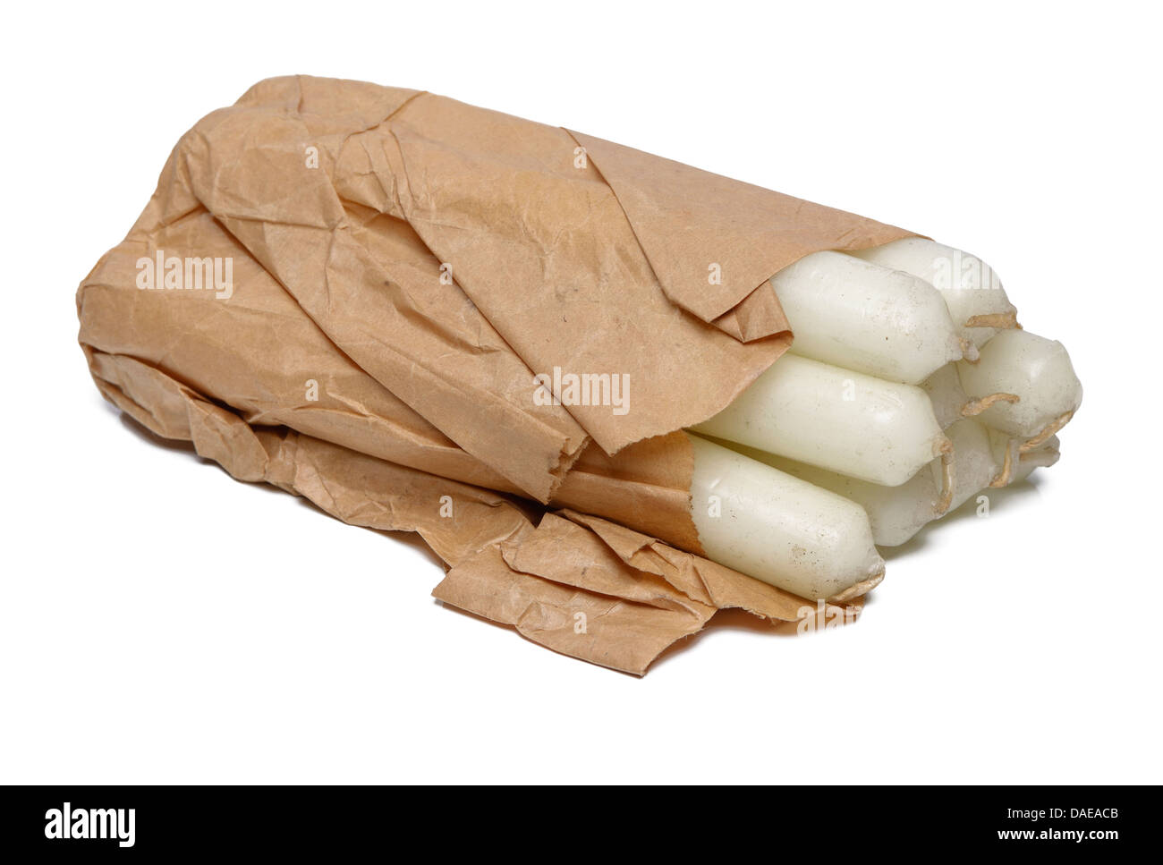 Bundle of candles wrapped in a brown paper bag Stock Photo