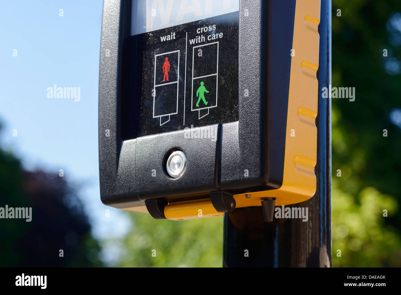 Close up of a pedestrian crossing showing the hidden button underneath Stock Photo