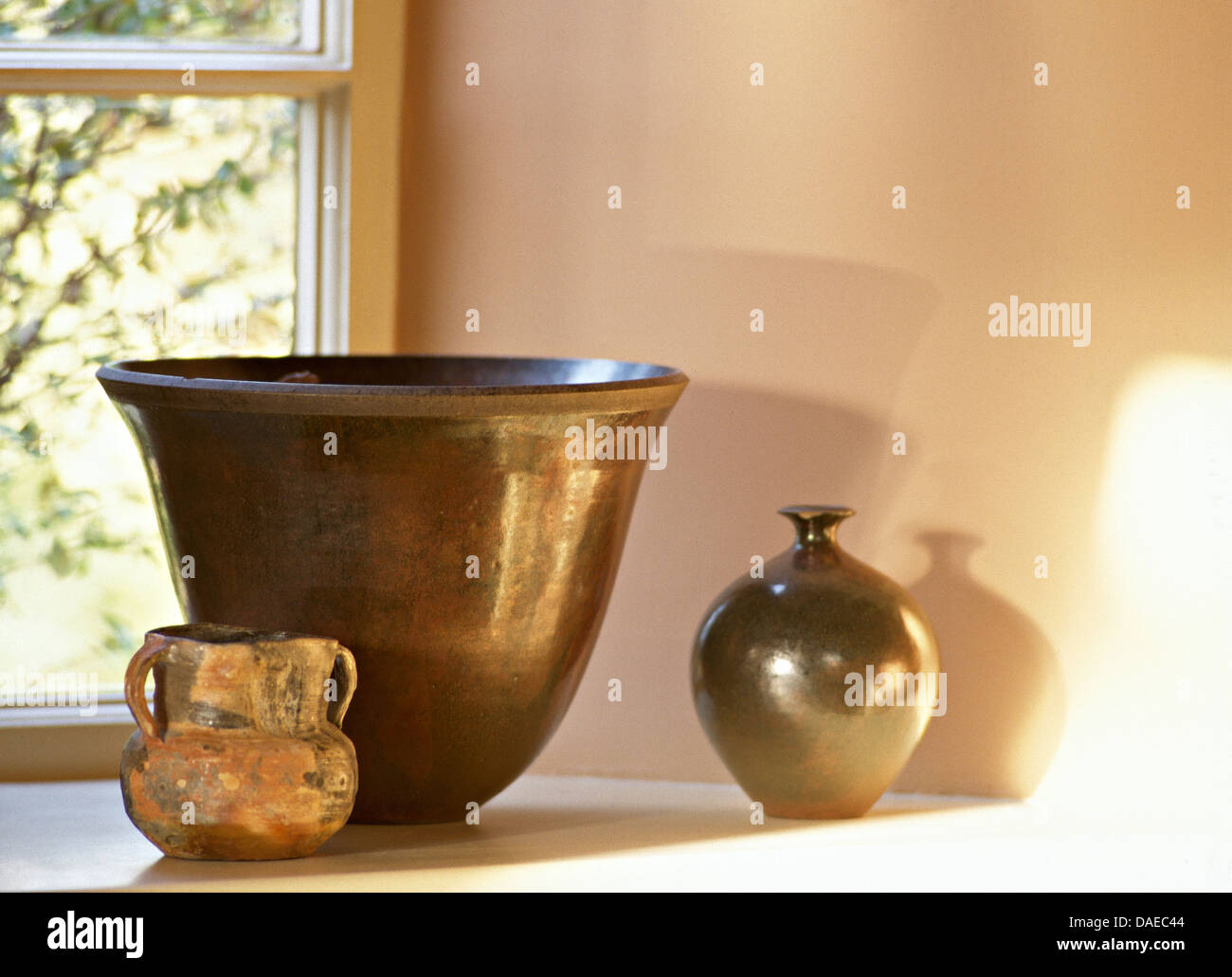 Close Up Of Rustic Pottery Bowl With Matching Vase And Pot Stock