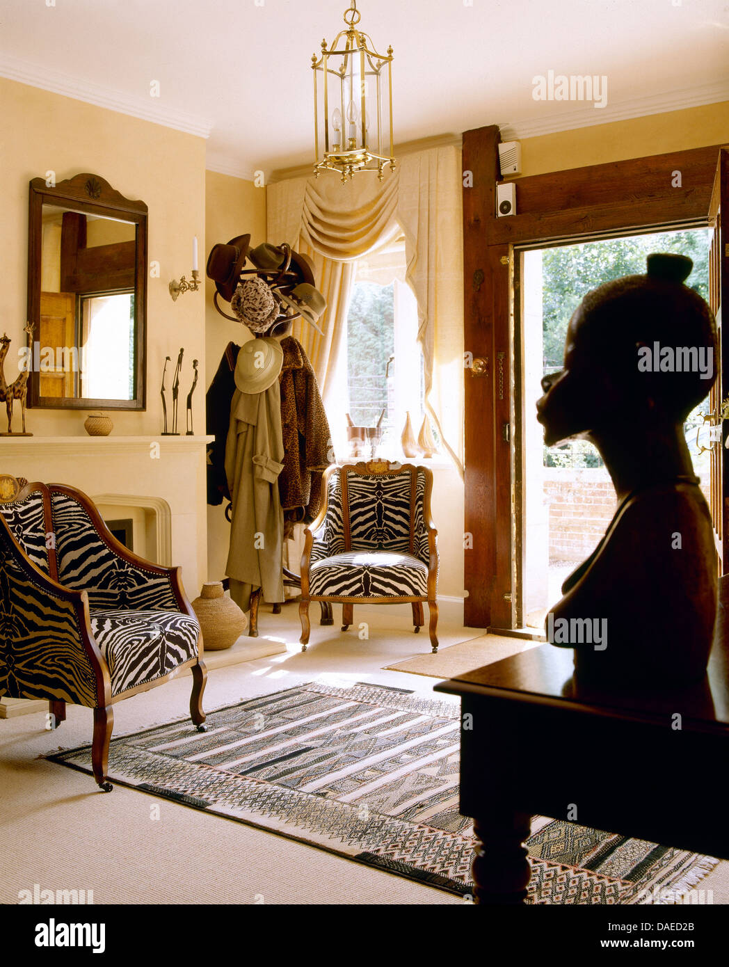 African Tribal Bust And Zebra Print Chairs In African