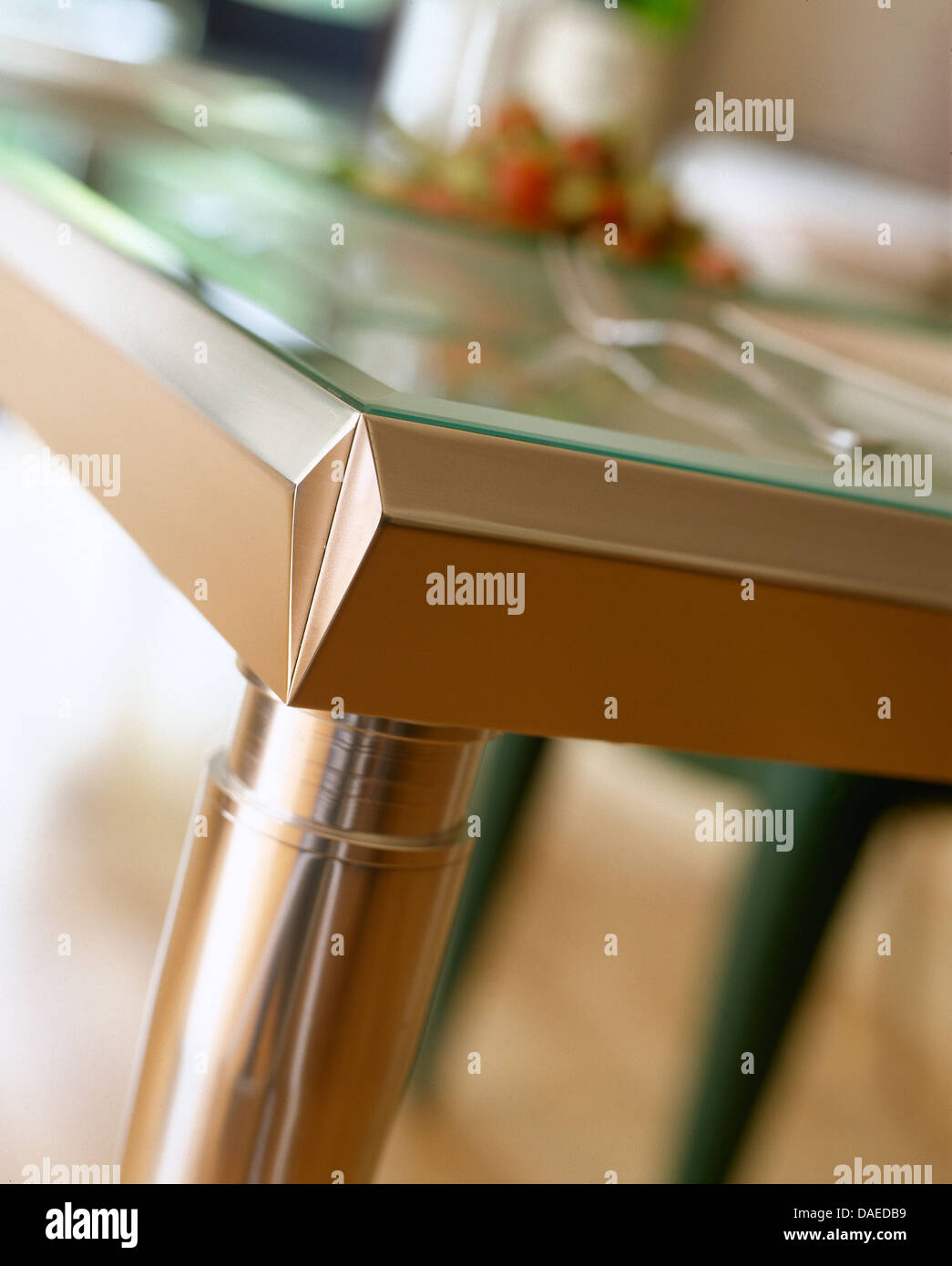 Closeup of modern metal dining table with glass top Stock Photo Alamy