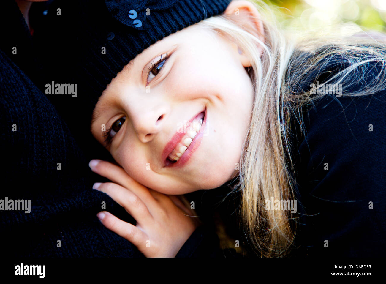 Smiling Blond Girl Wearing Blue Hat, Portrait Stock Photo Alamy