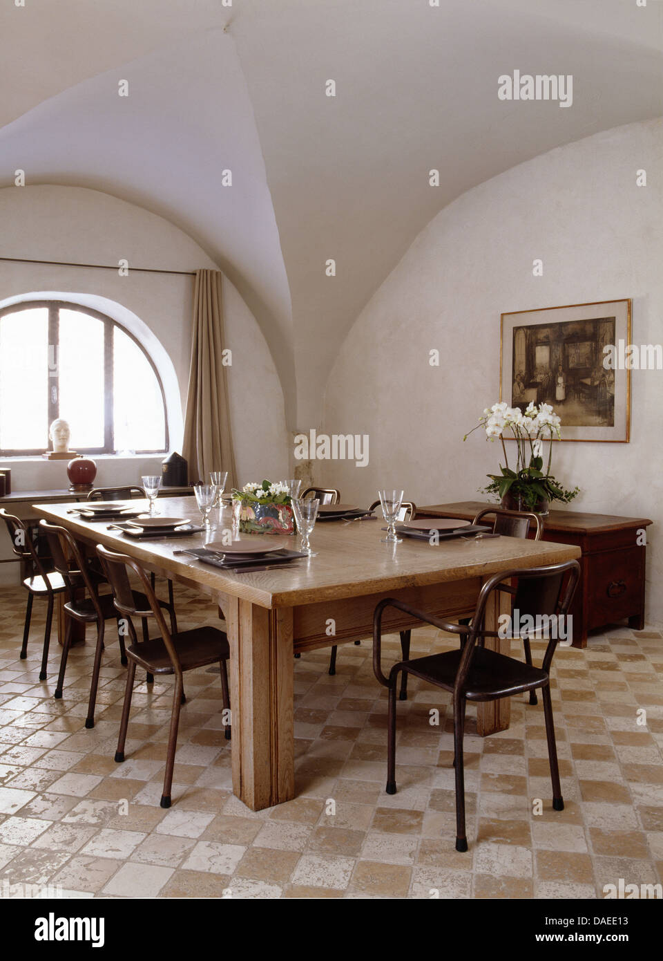 Black Metal Chairs At Large Wooden Table In French Country Dining