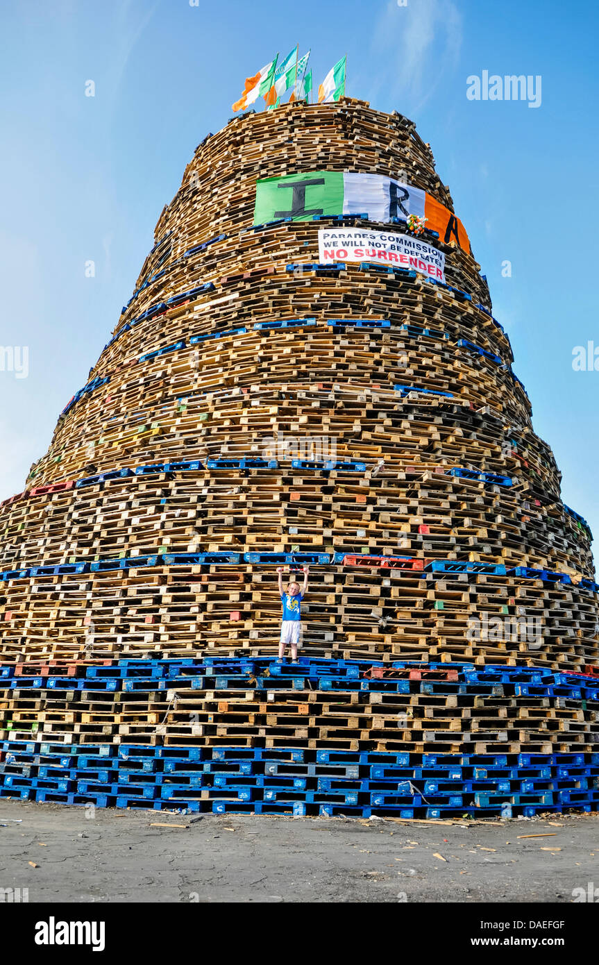 Belfast, Northern Ireland, 11th July 2013 A young boy climbs up the