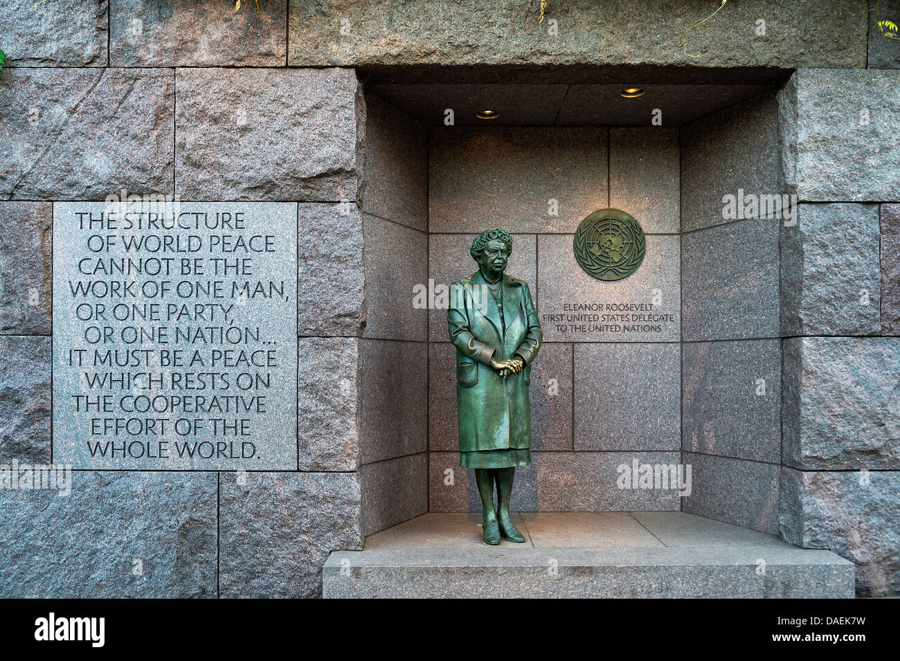 Bronze statue of First Lady Eleanor Roosevelt standing before the United Nations emblem honors her dedication to the UN, Frankli Stock Photo