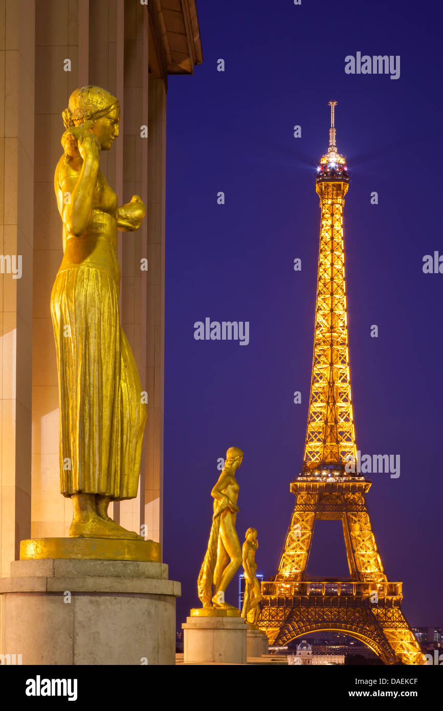 Golden statues at Palais de Chaillot with the Eiffel Tower beyond, Paris France Stock Photo