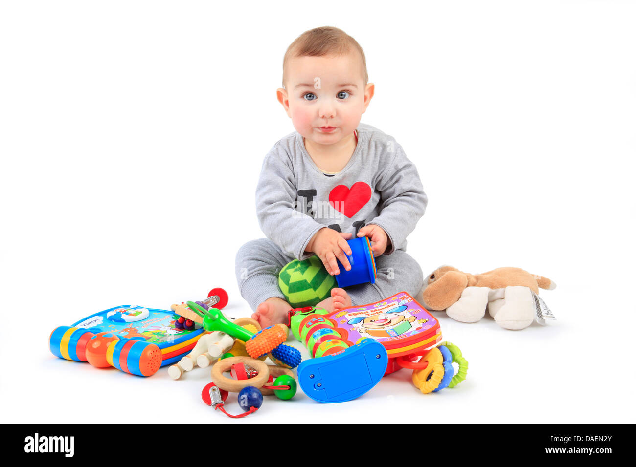 lively baby playing with playthings Stock Photo